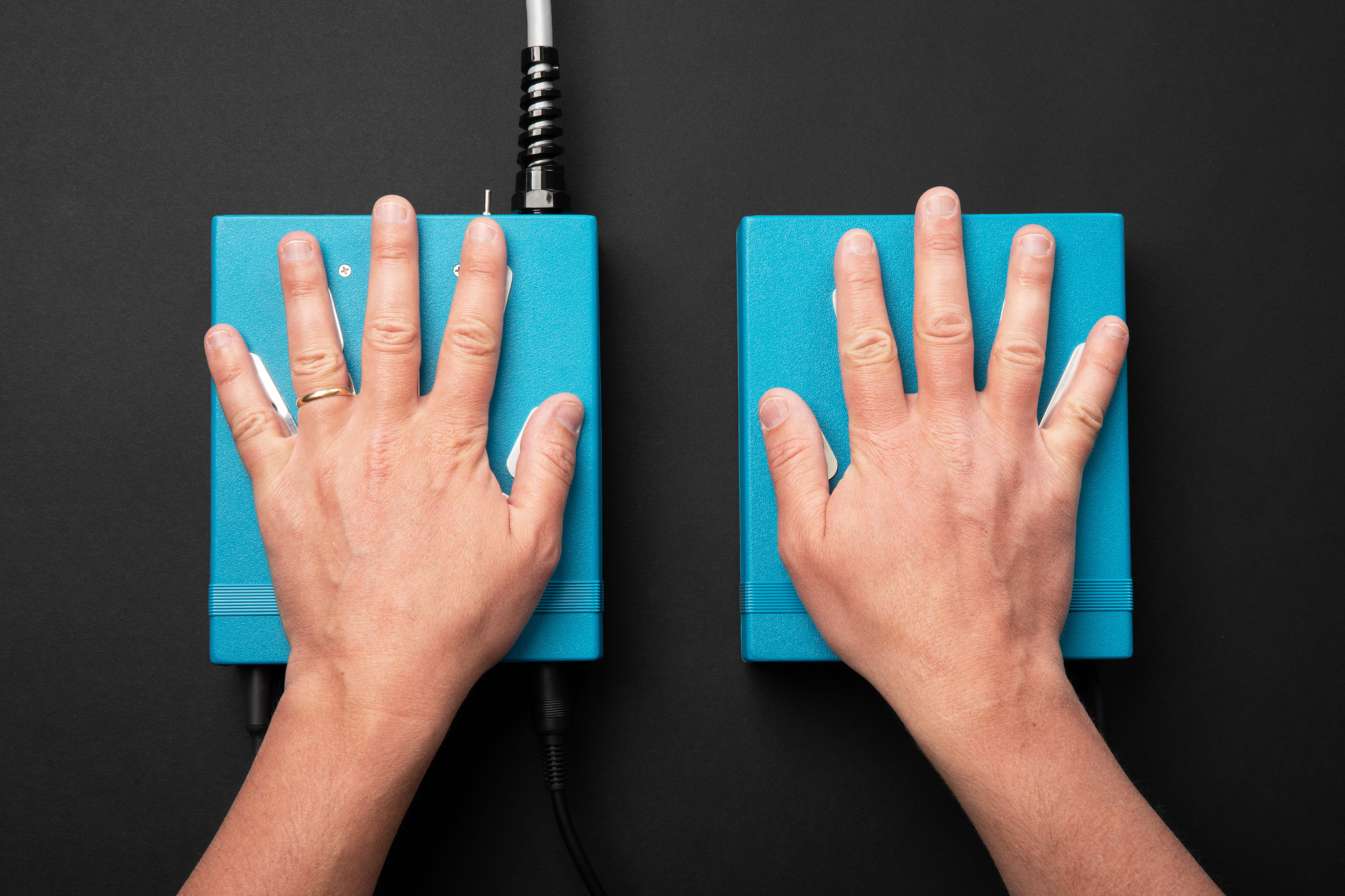 Hands resting on AuraCamera hand sensors