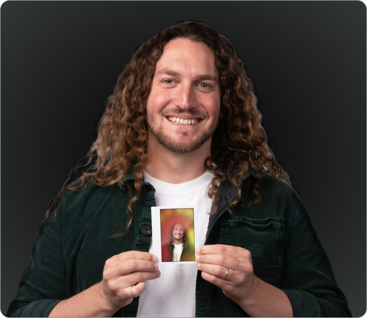 Person holding an AuraCamera instant-film portrait