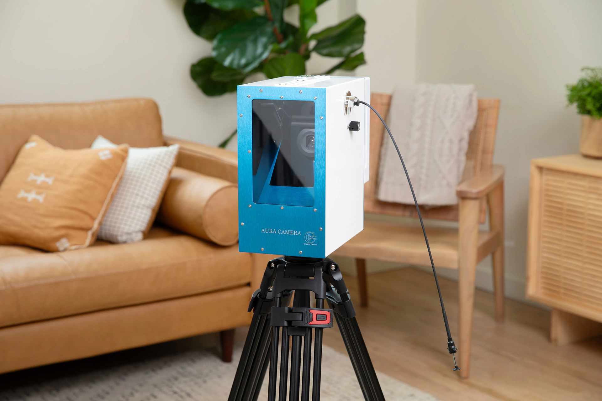AuraCamera 6000 setup with tripod in a living room