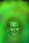 woman smiling with a green aura