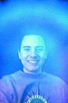 man smiling with an aura