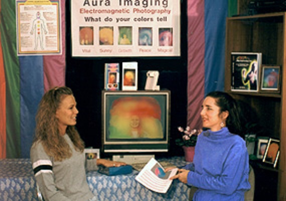 two women discussing an aura photo
